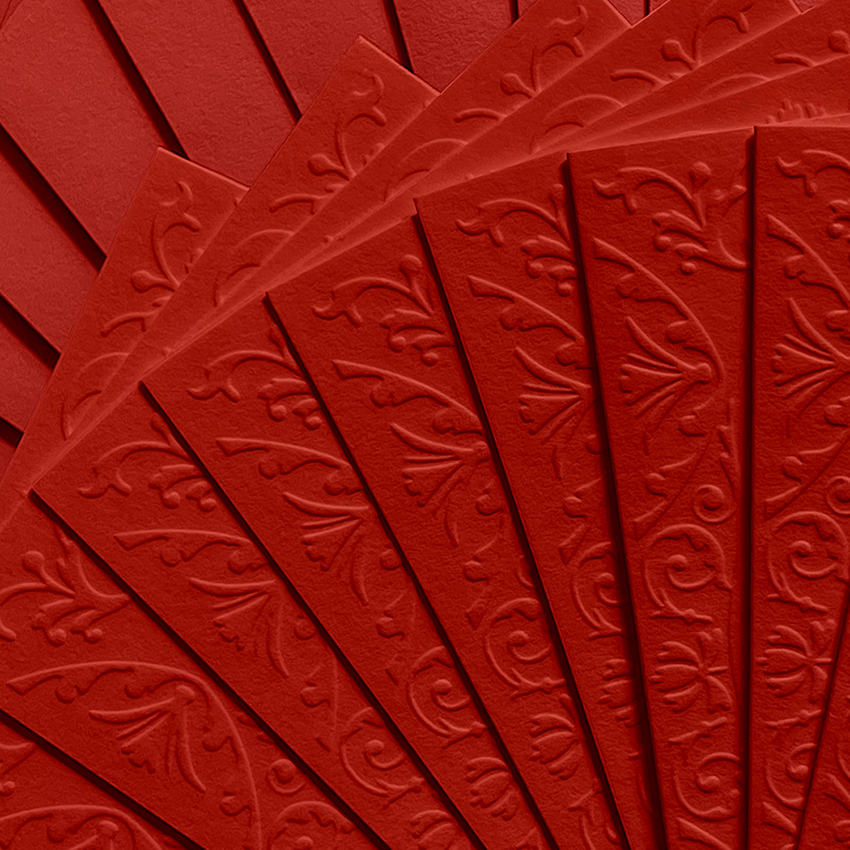 Close-up of a fan of Red Peony blind embossed greeting cards