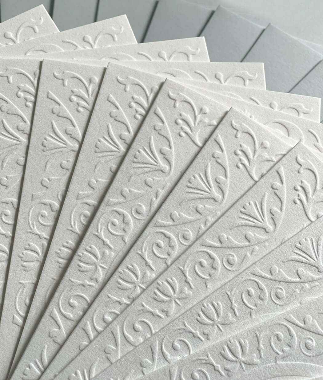 Blind embossed greeting card with blue envelope